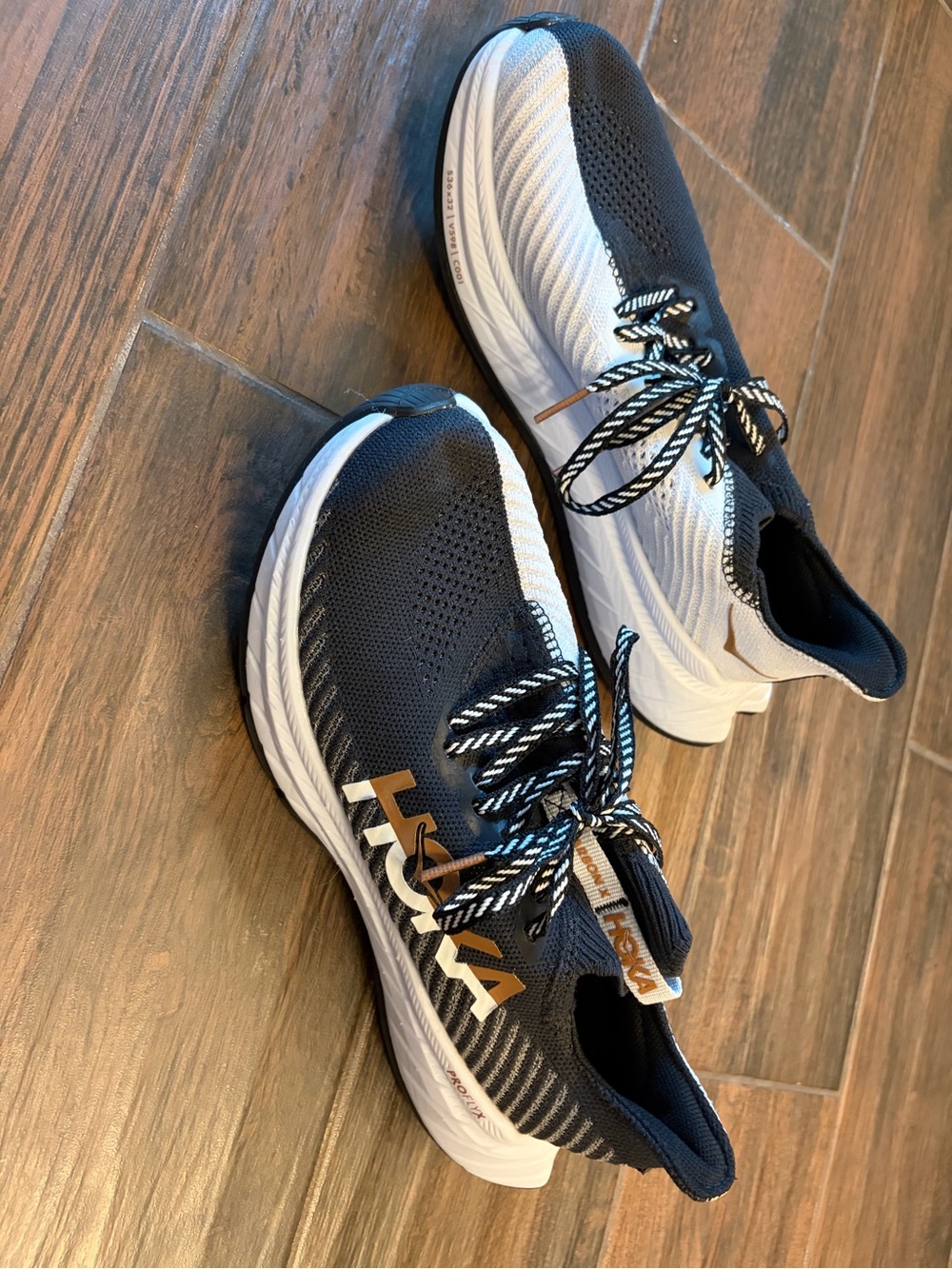 HOKA women’s Black and White Running Shoes